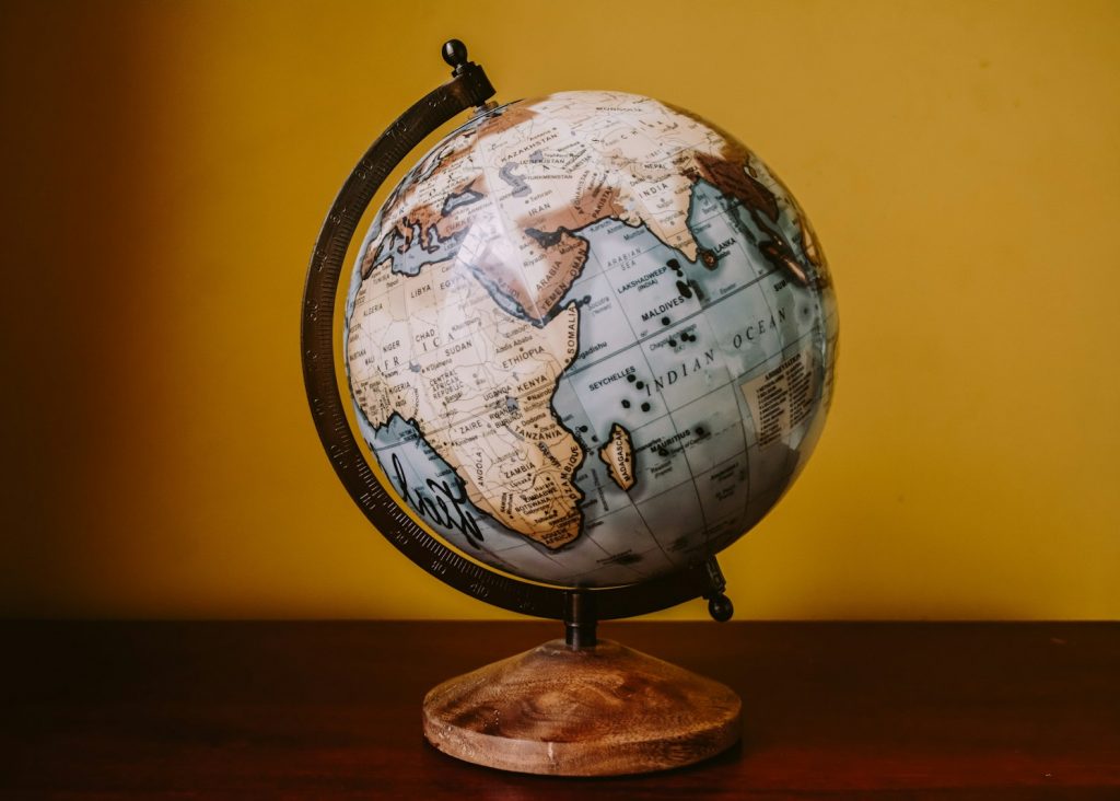 white and brown desk globe